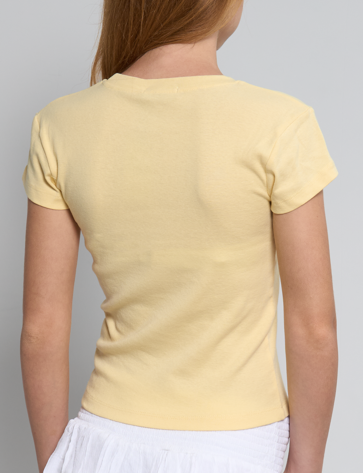 T-shirt gialla con stampa sole