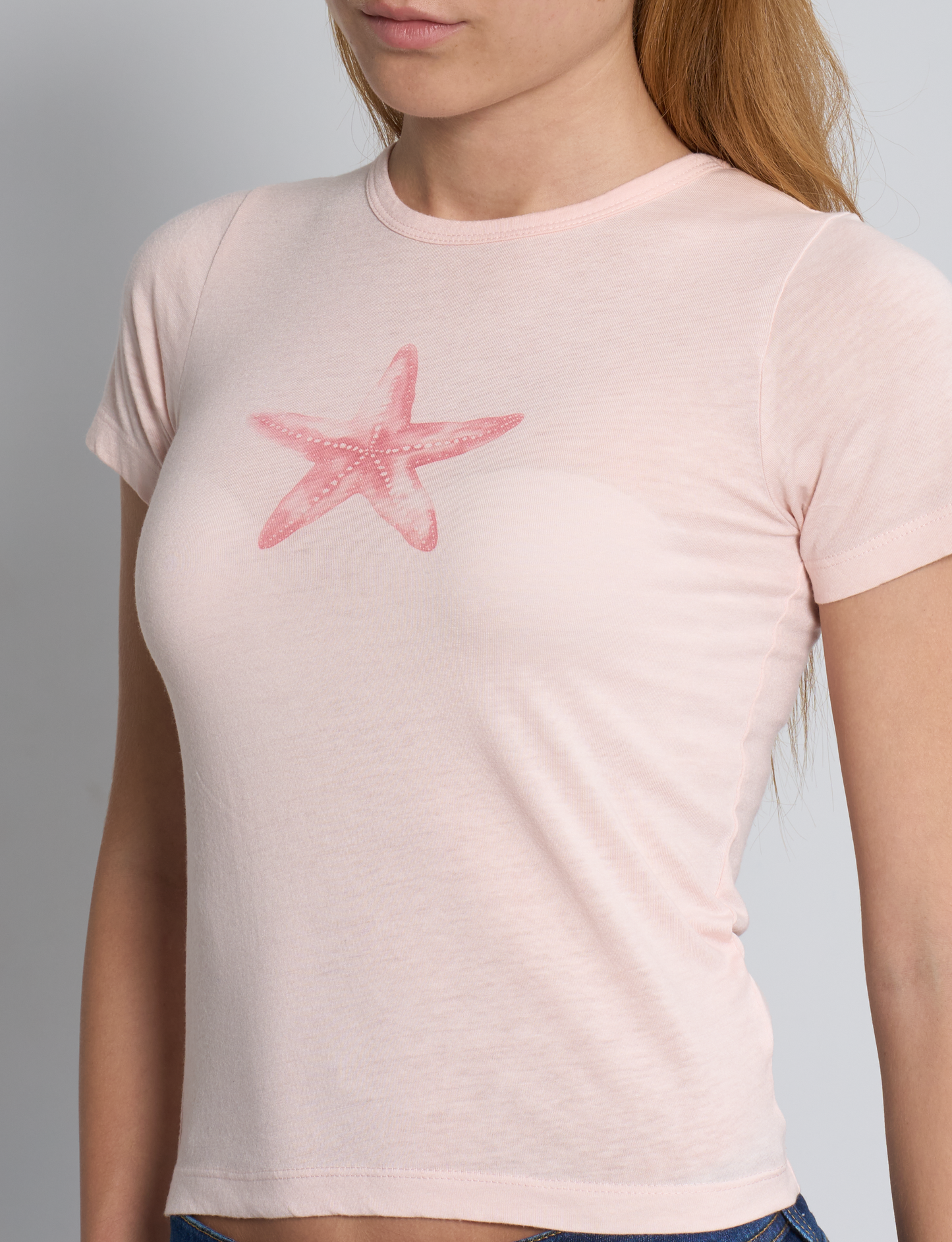 T-shirt rosa con stampa stella marina