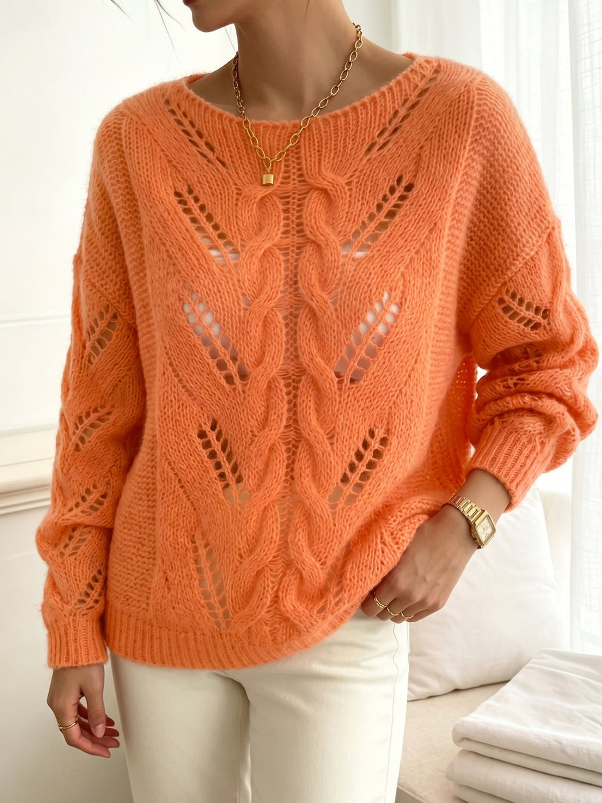 Jersey naranja vibrante de punto calado con textura