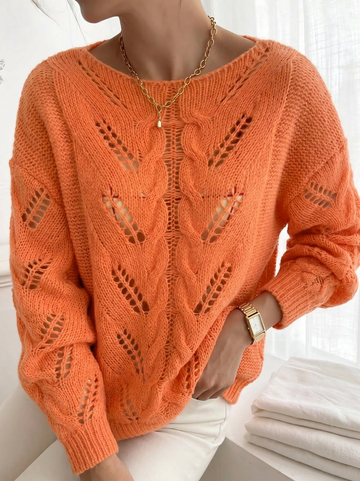 Jersey naranja vibrante de punto calado con textura