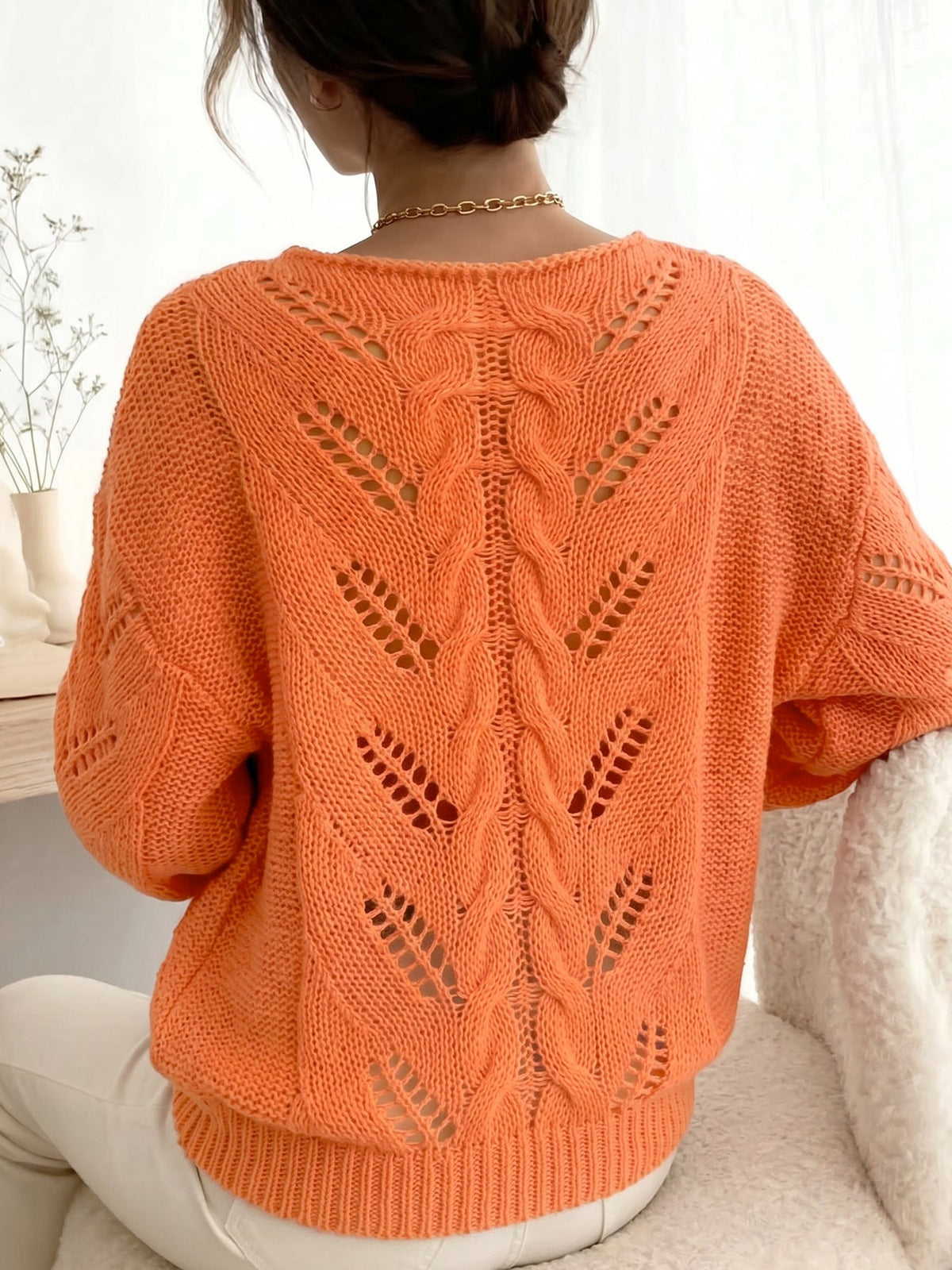Jersey naranja vibrante de punto calado con textura