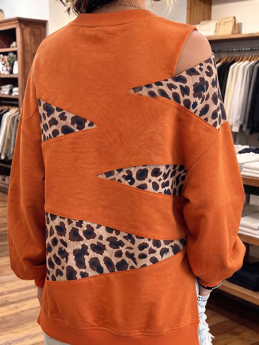 Sudadera elegante con detalle de leopardo y aberturas