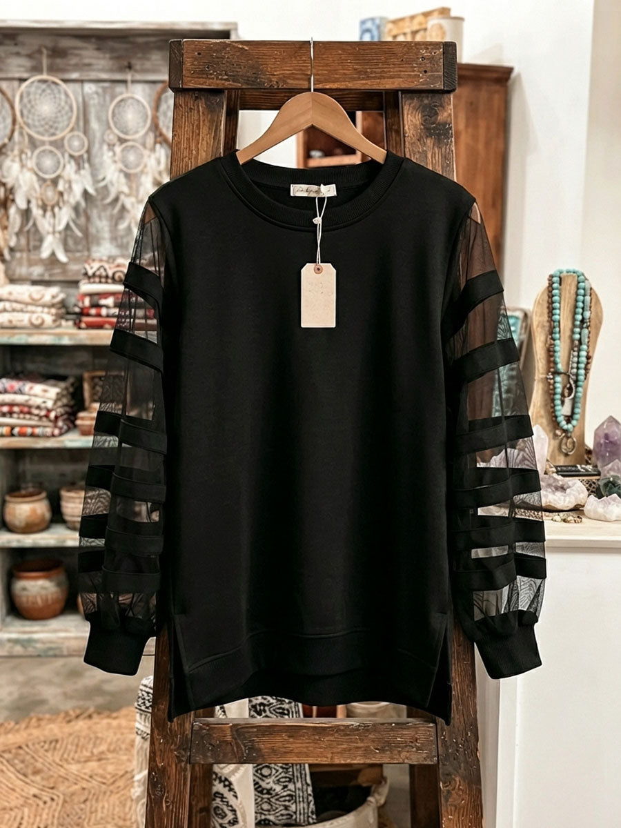 Elegante sudadera negra con paneles de malla