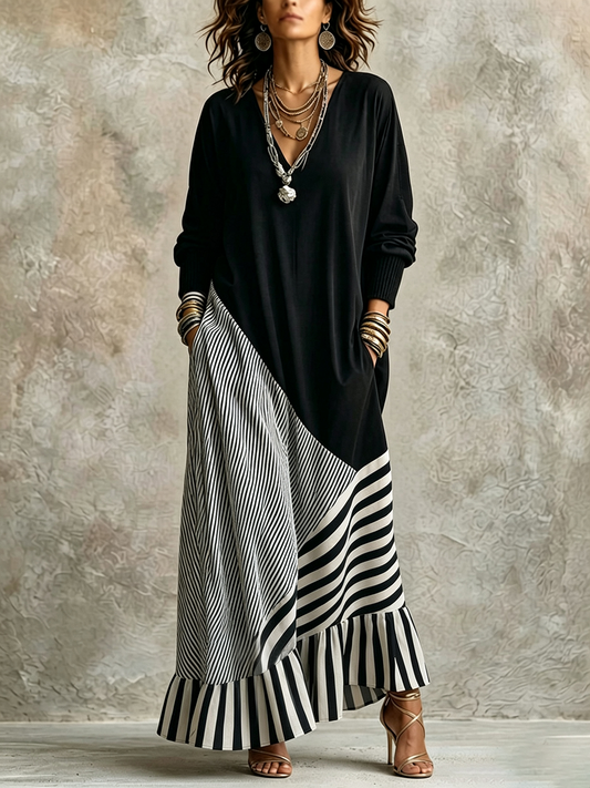 Elegante vestido maxi negro y de rayas con tejido elástico