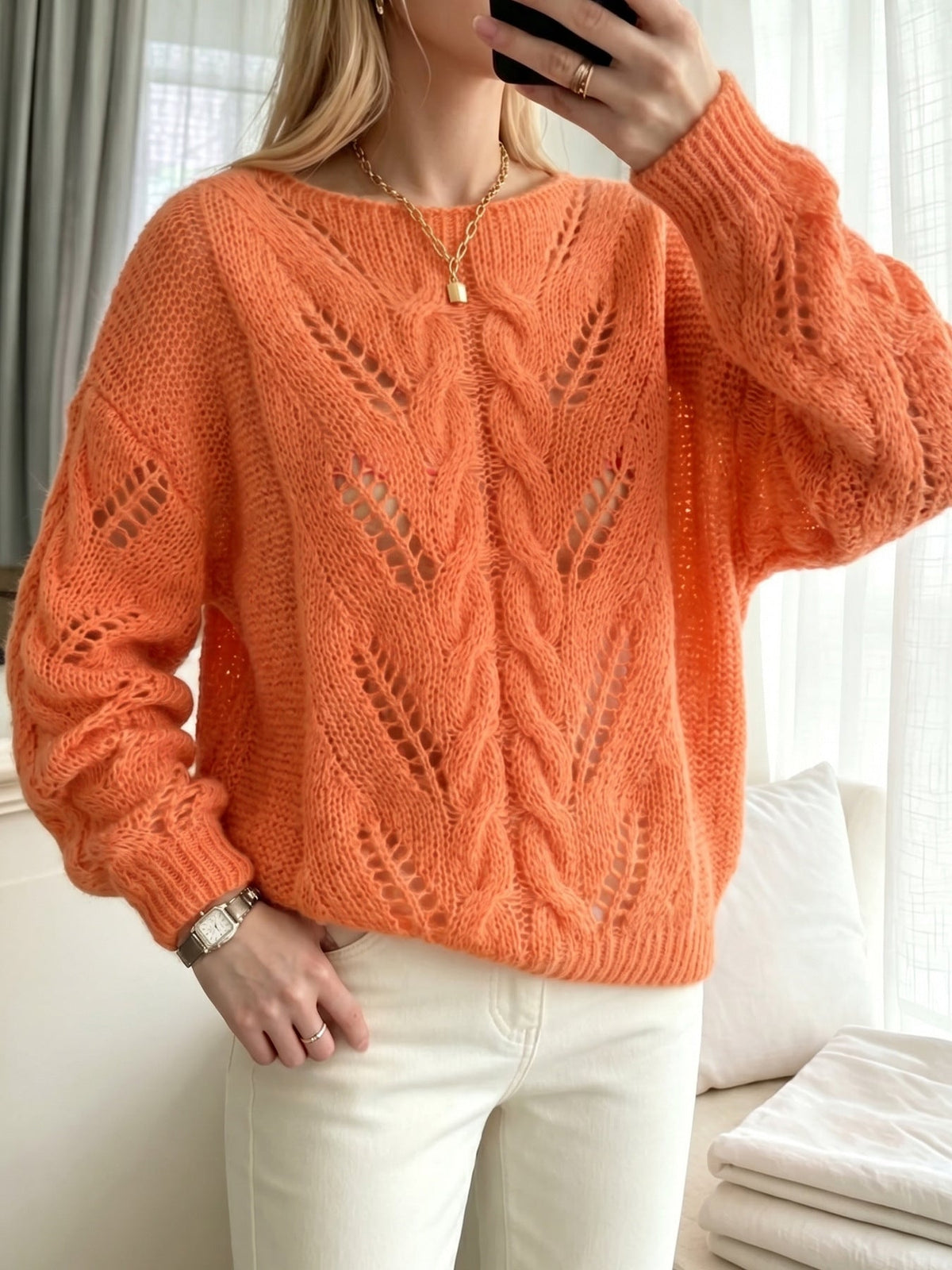 Jersey naranja vibrante de punto calado con textura